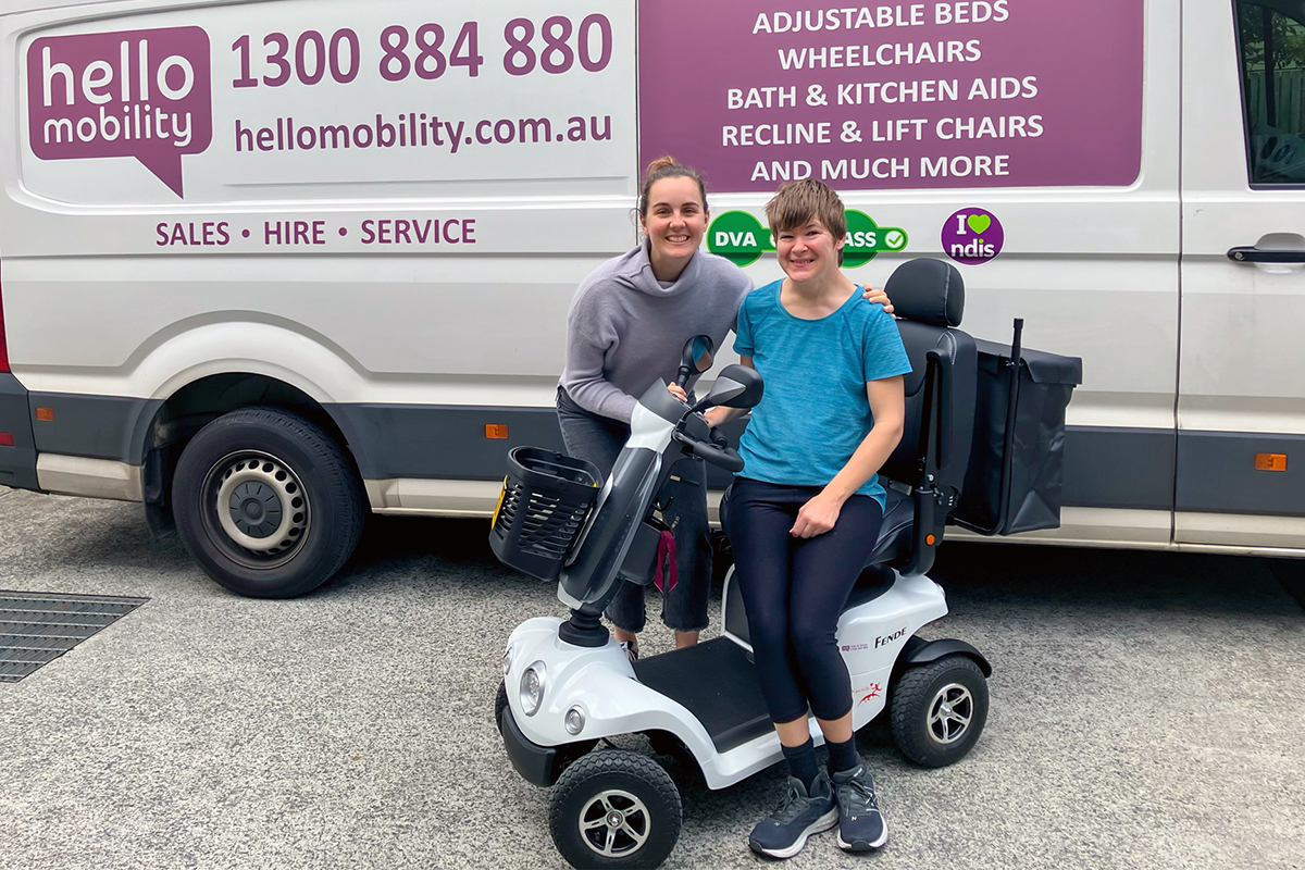 Occupational Therapist Jess M alongside Sarah showcasing her new Merits Fende S946 4-Wheel Mobility Scooter