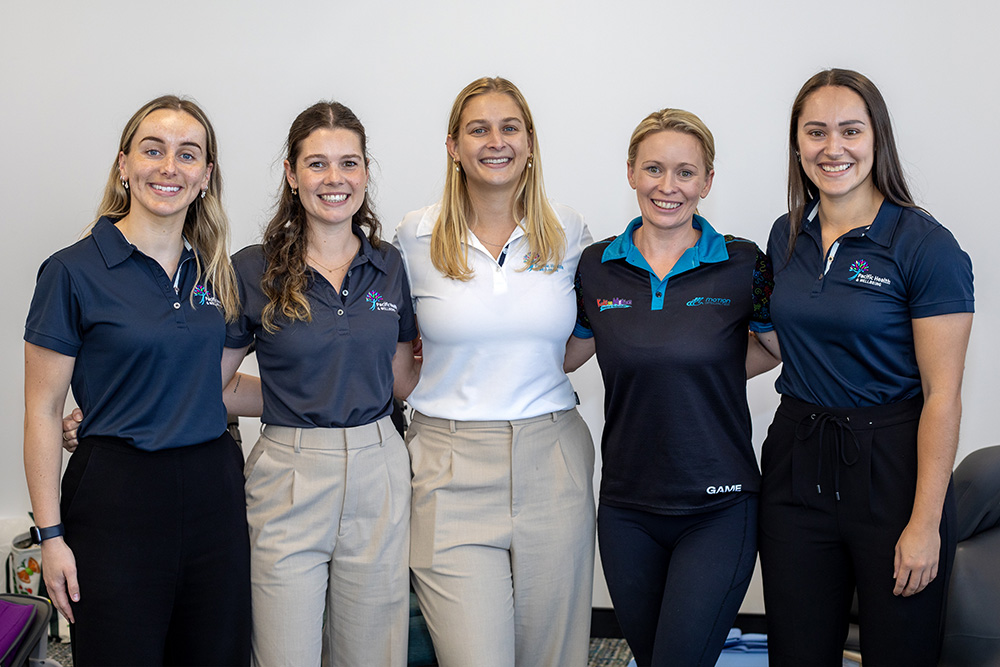 Pacific Health & Wellbeing’s Gold Coast team - Megan, Ally, Sarah, Hayley (Motion Specialties and Kids in Motion), and Kirra - following a session on paediatric assistive technology (AT) solutions and the participants who could benefit from them